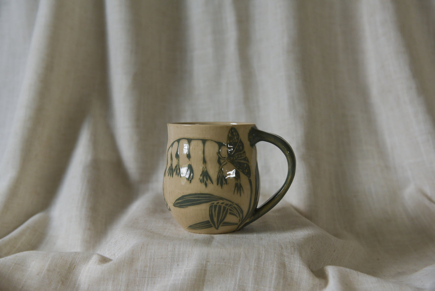 Moth and flowers mug