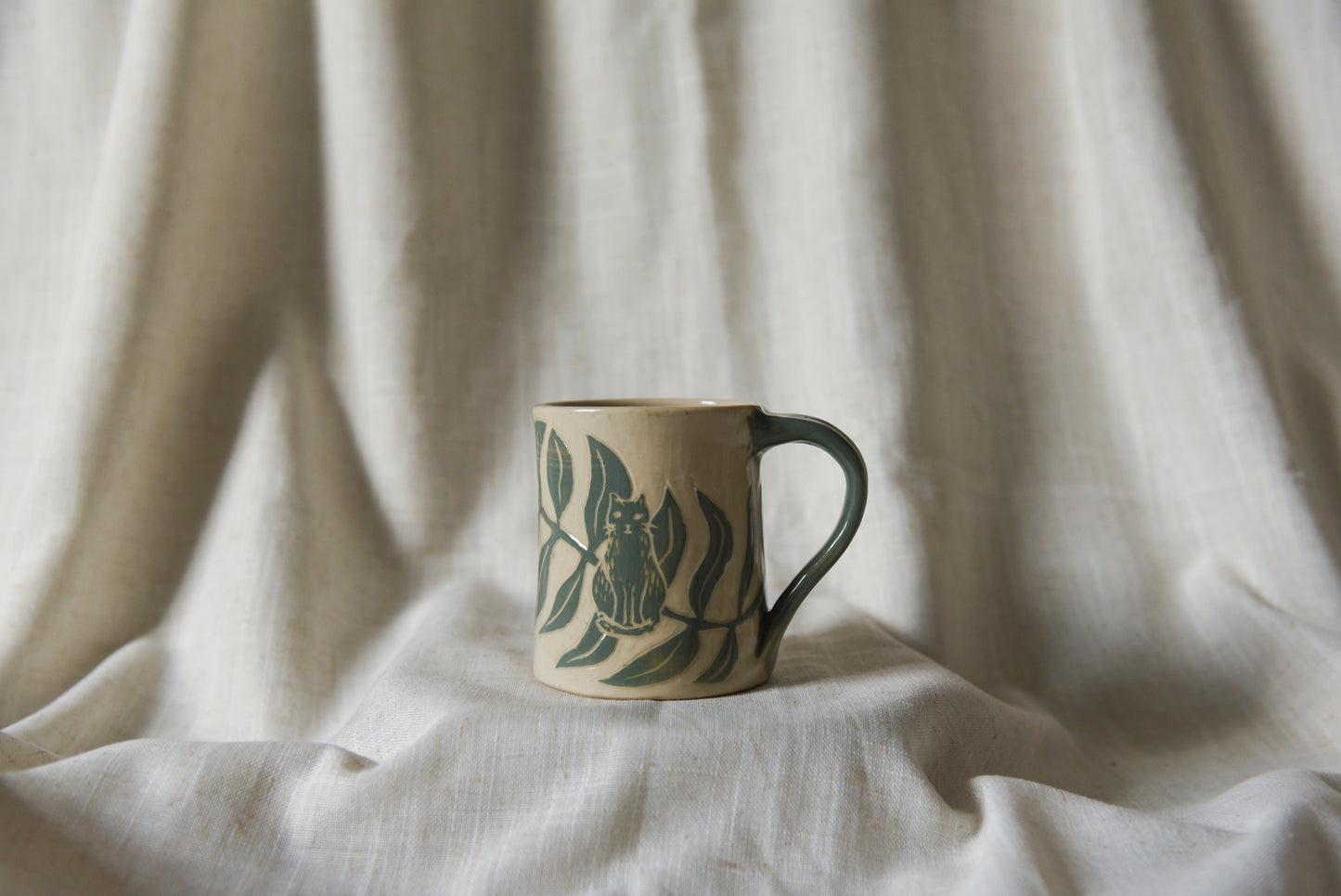Cat among Leaves Mug