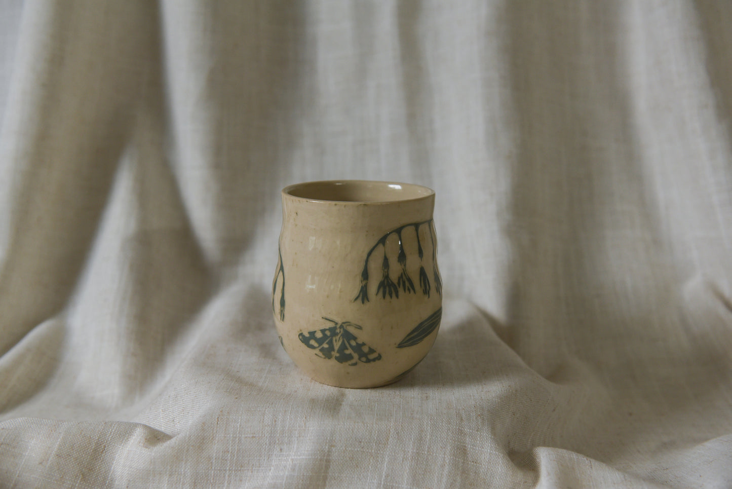 Moth and flowers mug