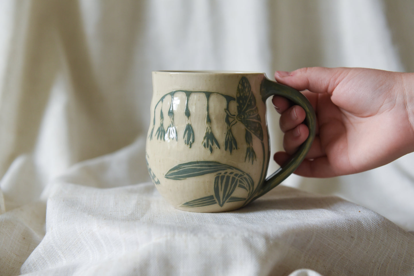 Moth and flowers mug