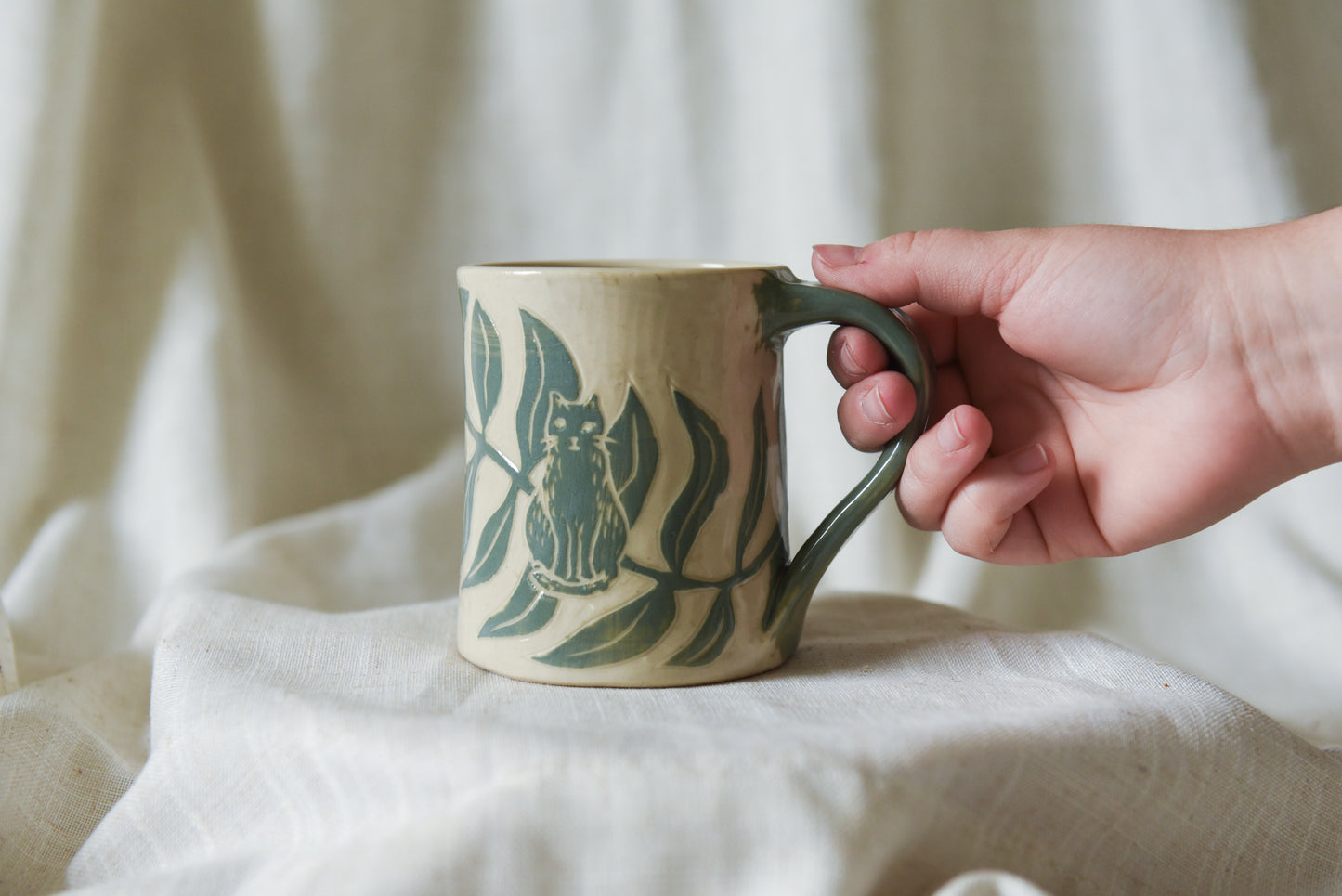 Cat among Leaves Mug