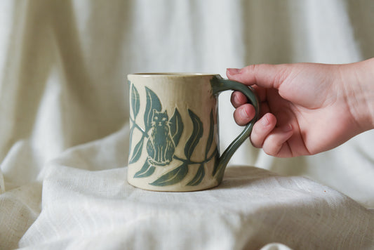 Cat among Leaves Mug