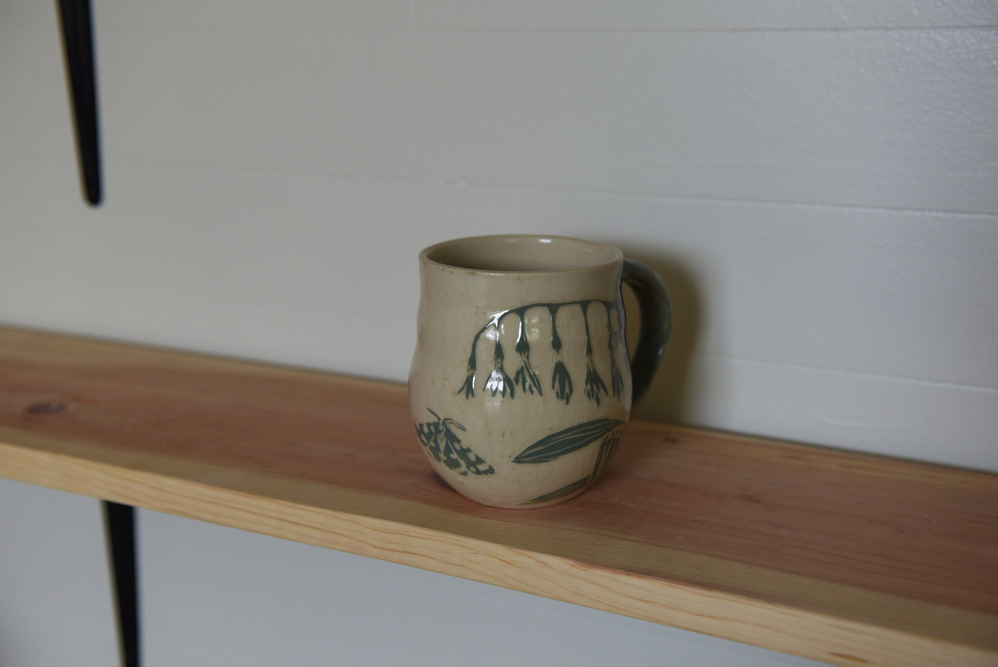 Moth and flowers mug
