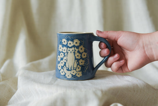 Cat in a Flower Field Mug