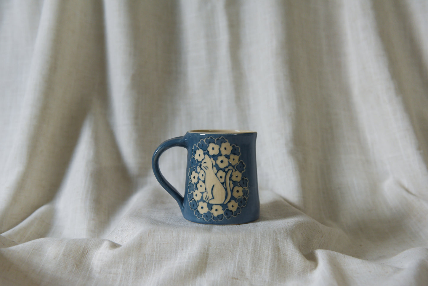 Cat in a Flower Field Mug
