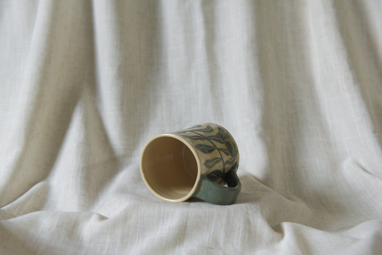 Cat among Leaves Mug